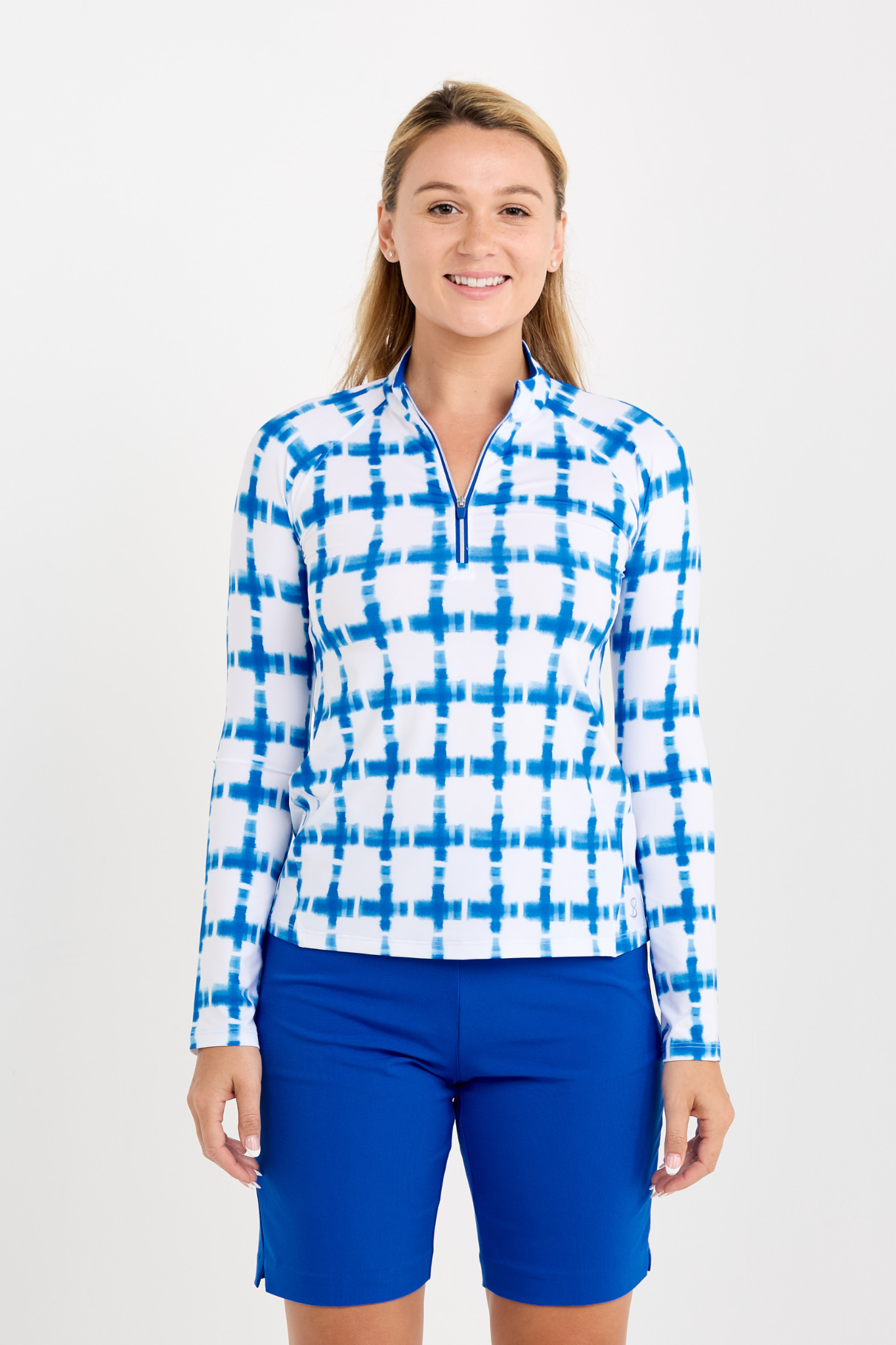 Women's Raglan Long Sleeve Golf Zip Pullover by Sofibella, front view on model