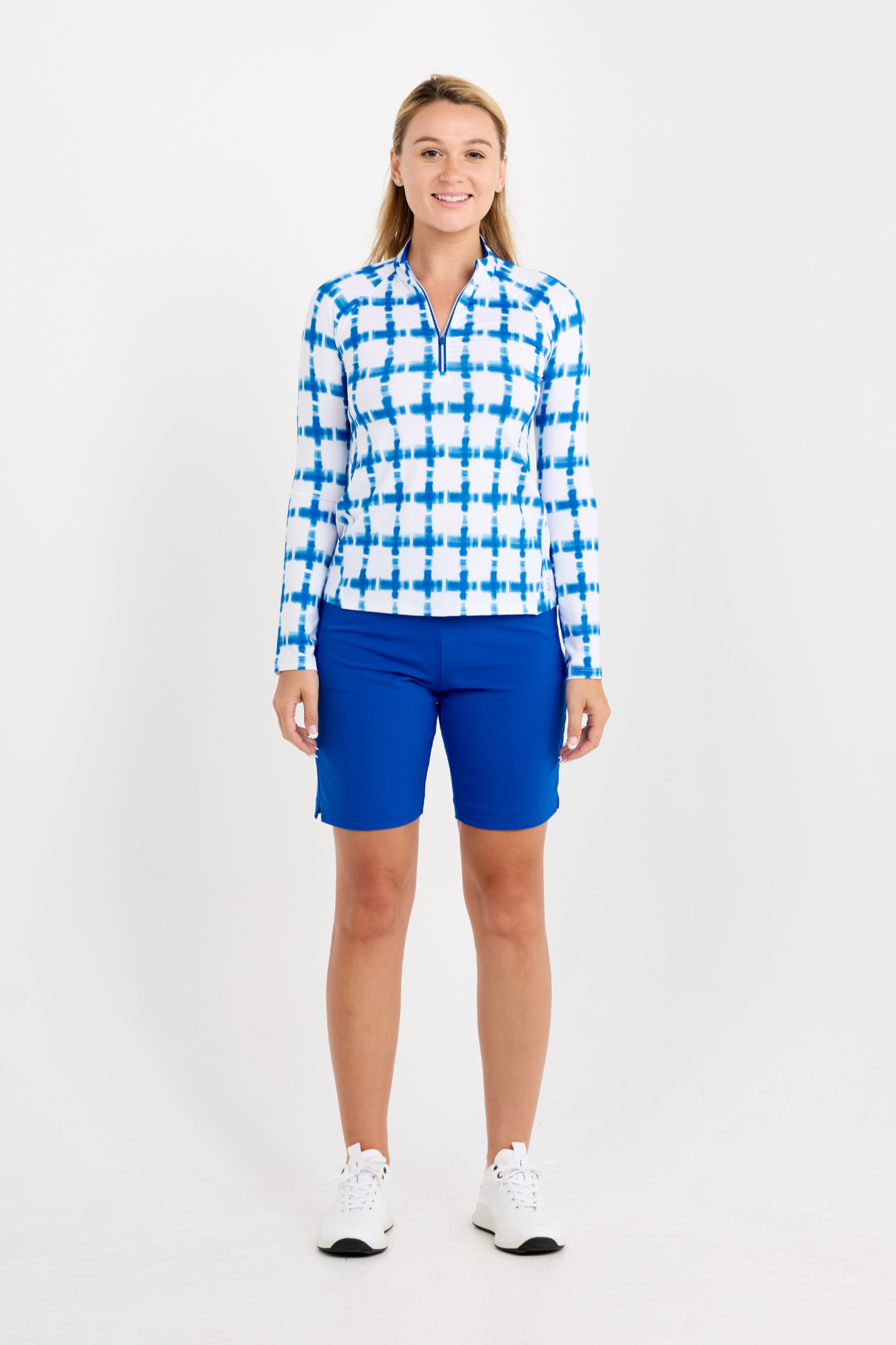 Women's Raglan Long Sleeve Golf Zip Pullover by Sofibella, front view on model