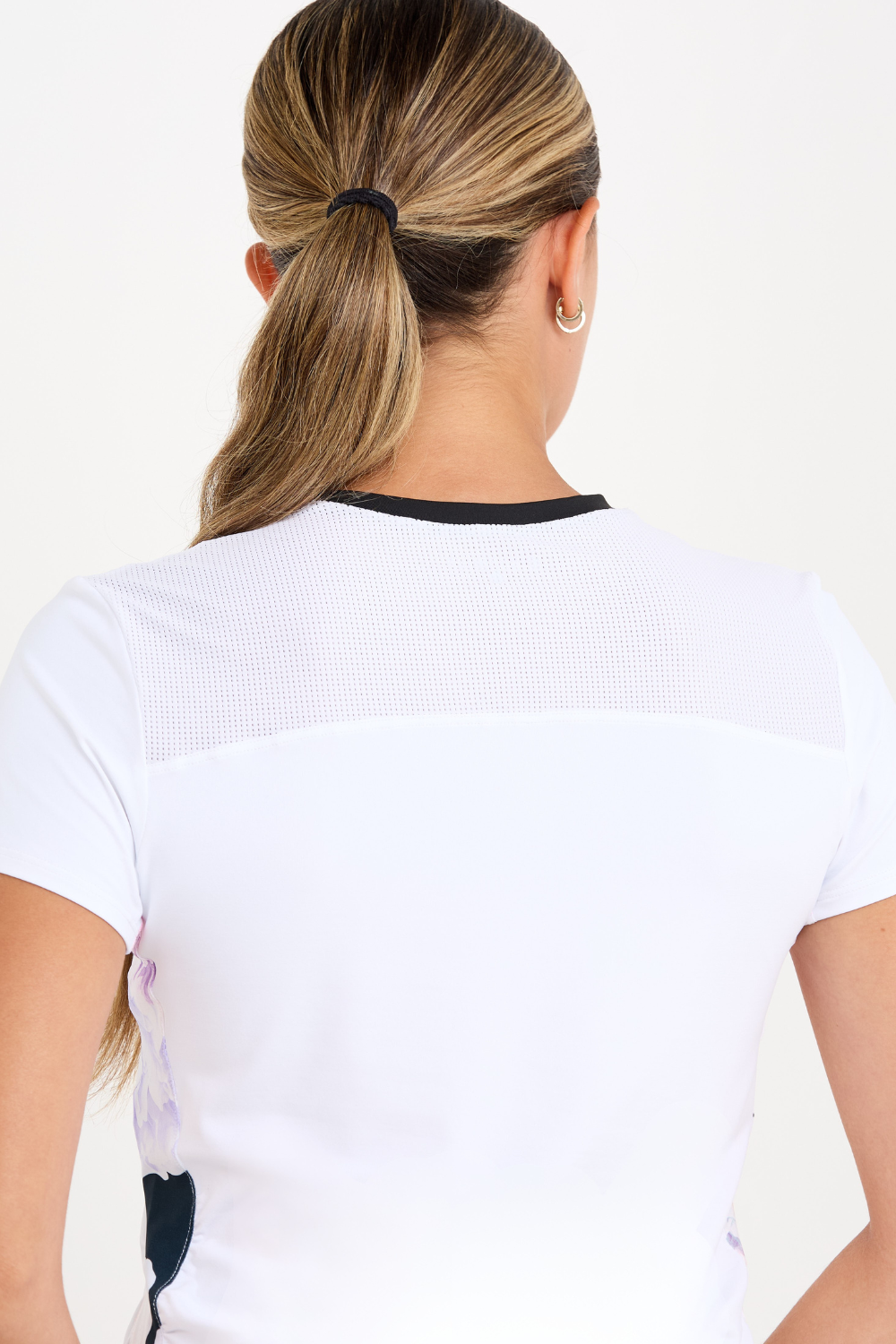 Women's Side Shirred Short Sleeve Tennis Top by Sofibella, close up back view on model