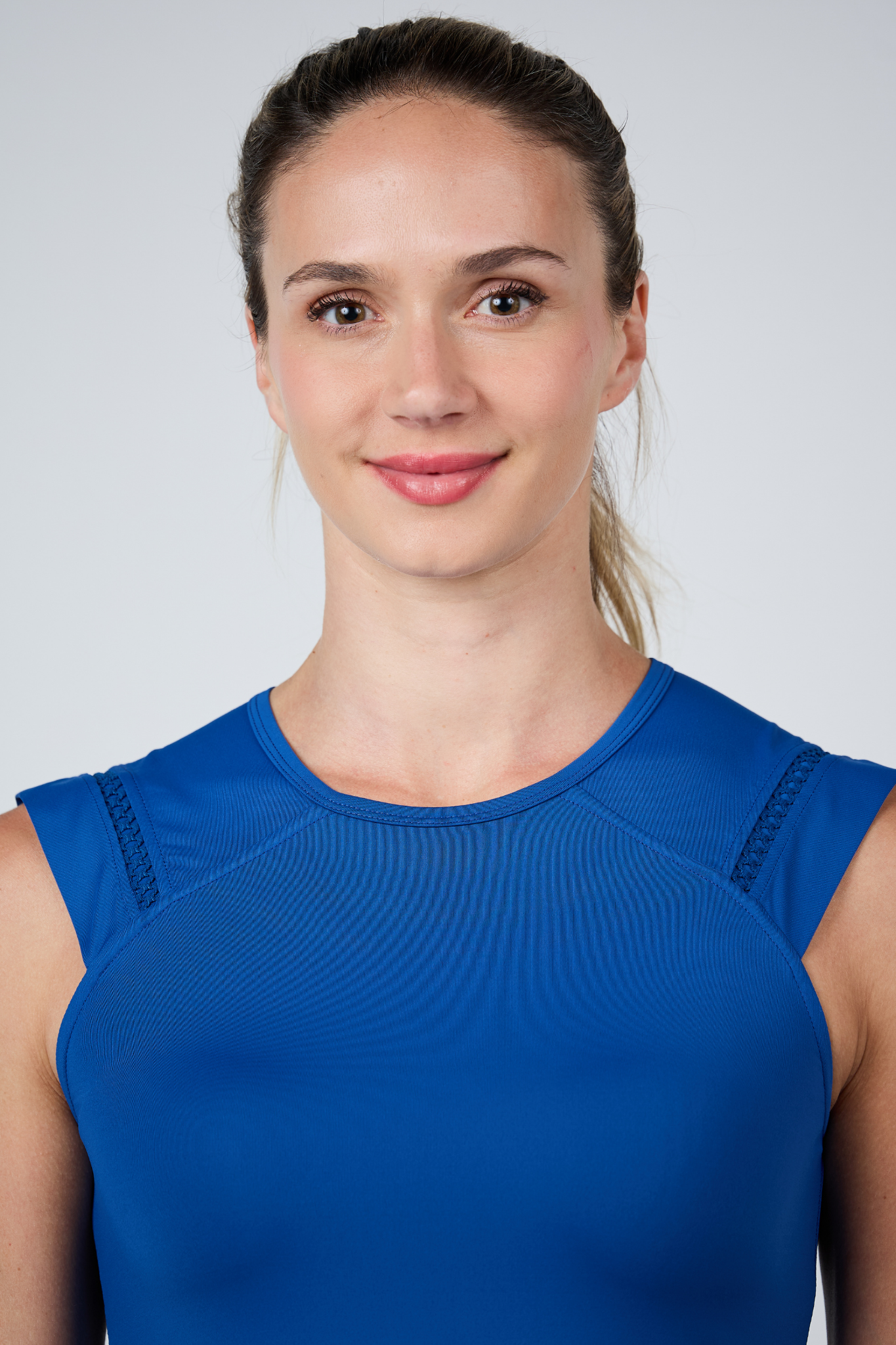 Perfect Storm Women’s Sleeveless Tennis Top by Sofibella - front close up view on model