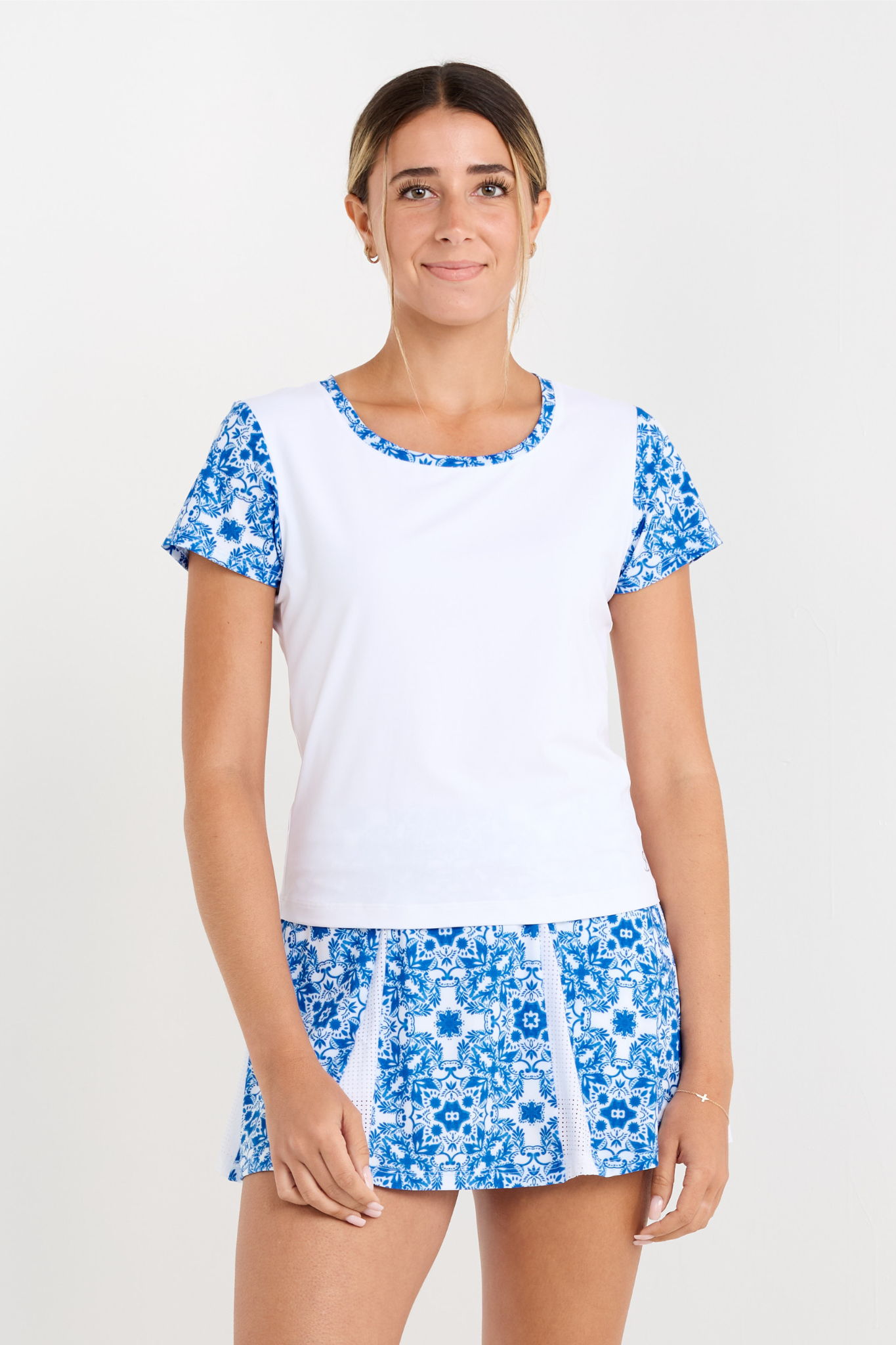 Miss Santorini Women's Short Sleeve Tennis Top by Sofibella, front view on model