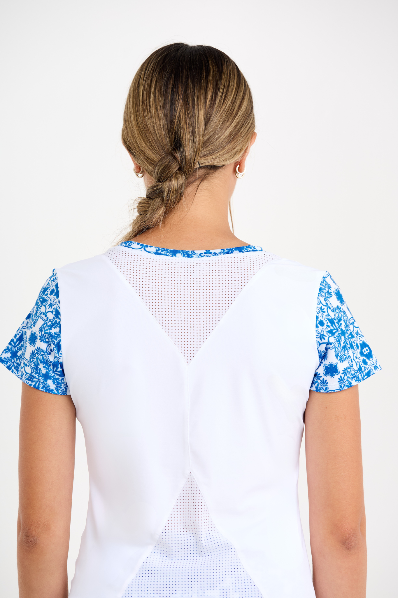Miss Santorini Women's Short Sleeve Tennis Top by Sofibella, detail view of back on model