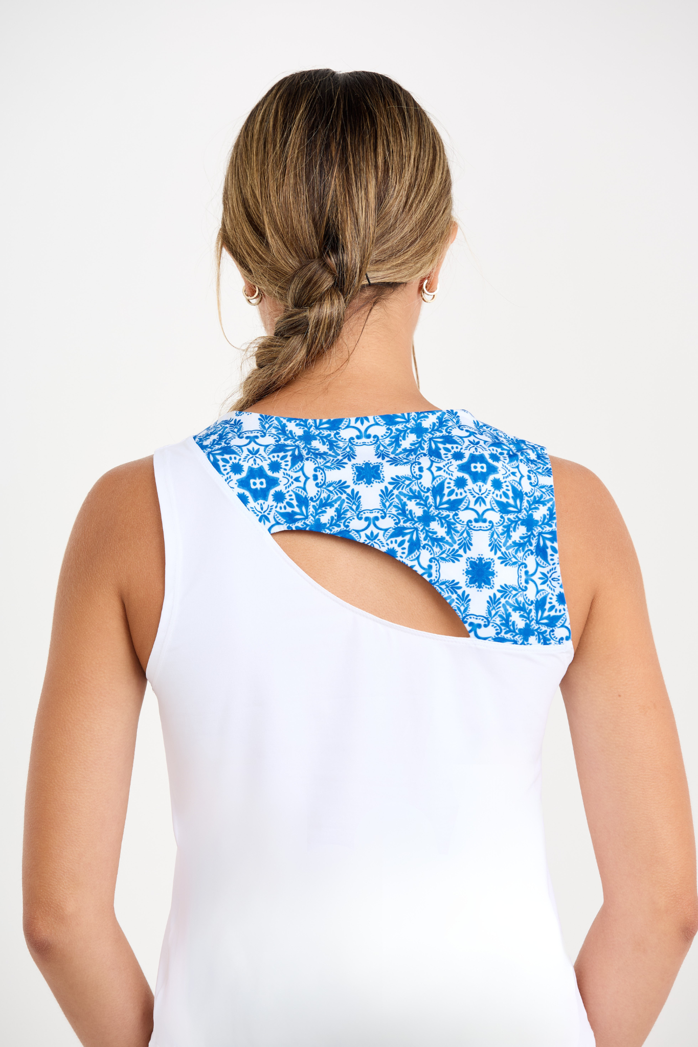 Miss Santorini Women's Sleeveless Tennis Top by Sofibella, white with Sandra tile insert, close up back view on model