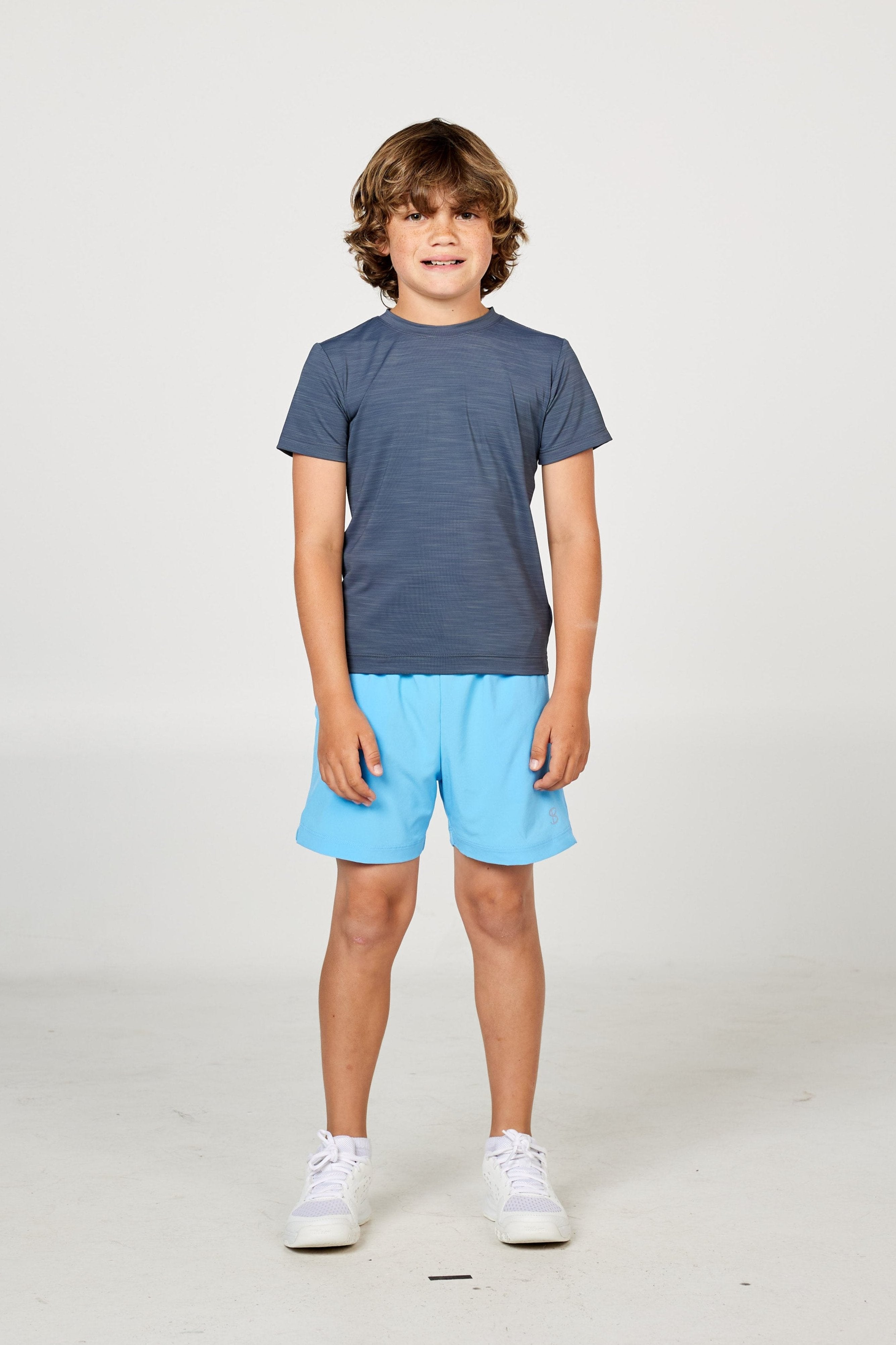 Charcoal boys' short sleeve tennis top by Sofibella, front view on model