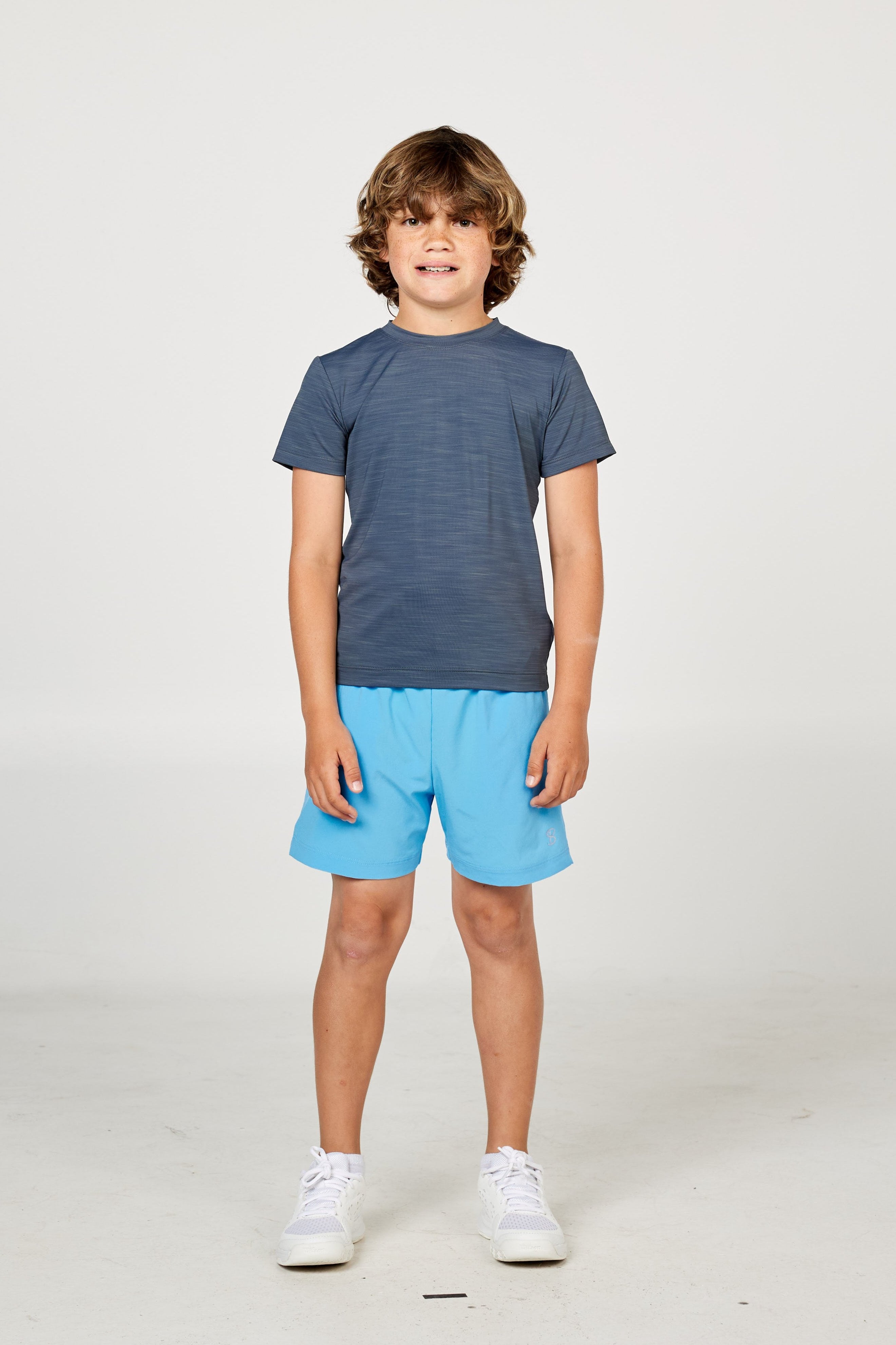 Charcoal boys' short sleeve tennis top by Sofibella, front view on model