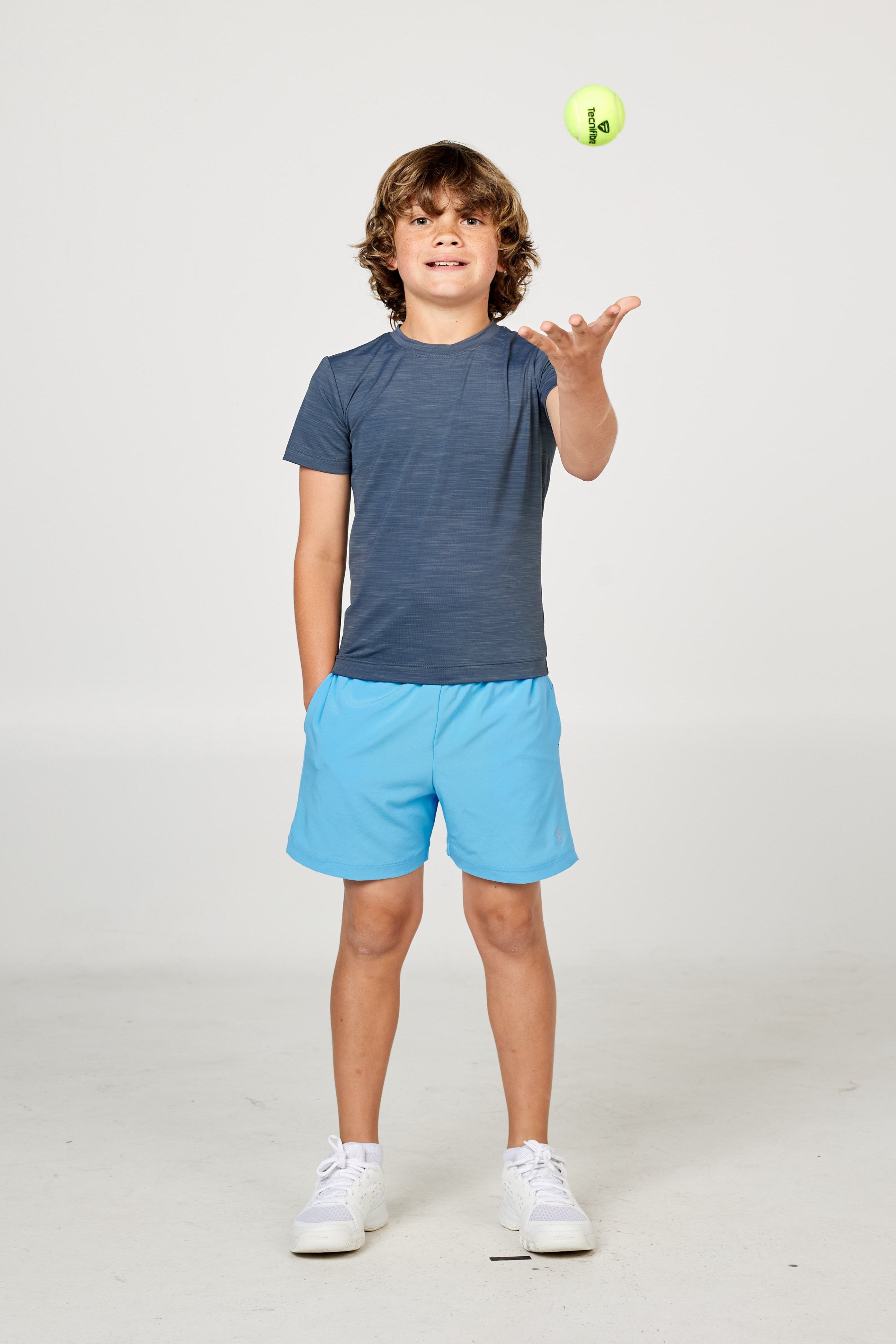 Charcoal boys' short sleeve tennis top by Sofibella, front view on model