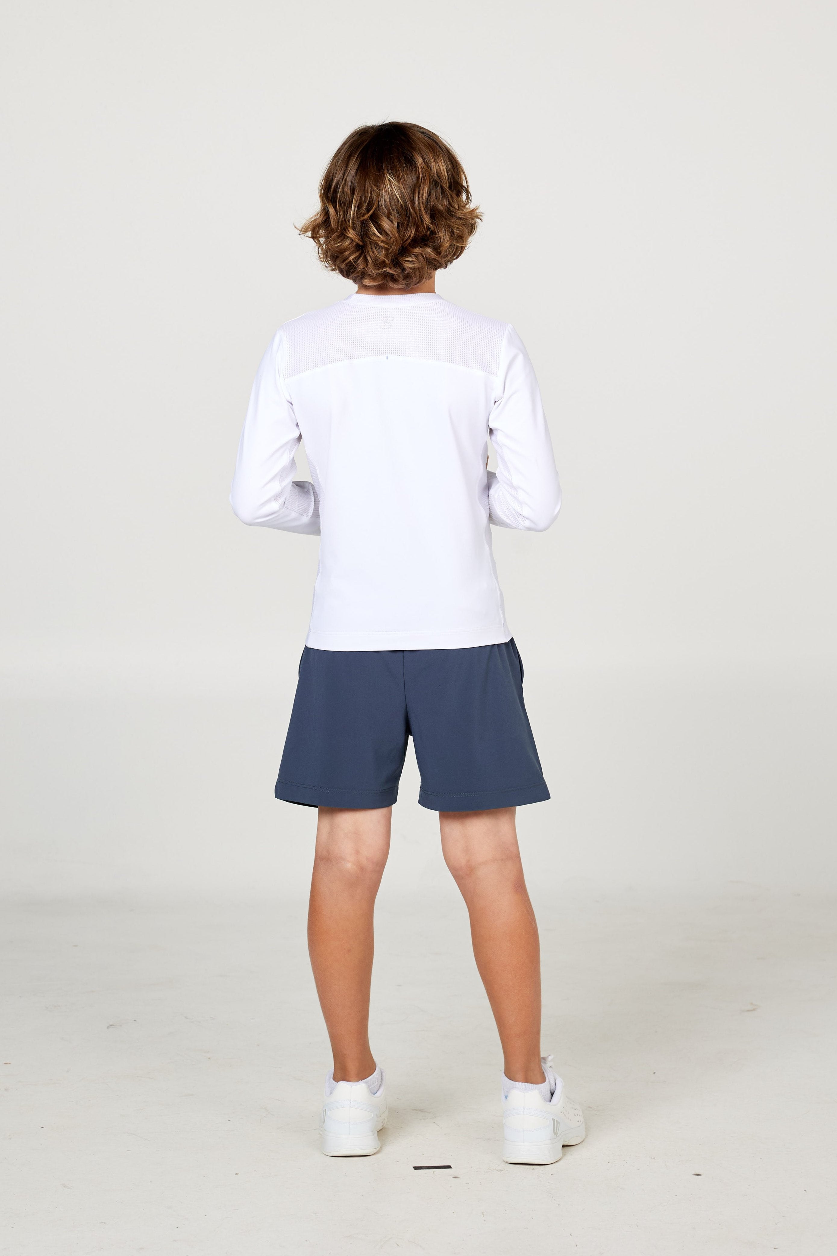 Perfect Volley Boy's White Long Sleeve Tennis Top by Sofibella, back view on model