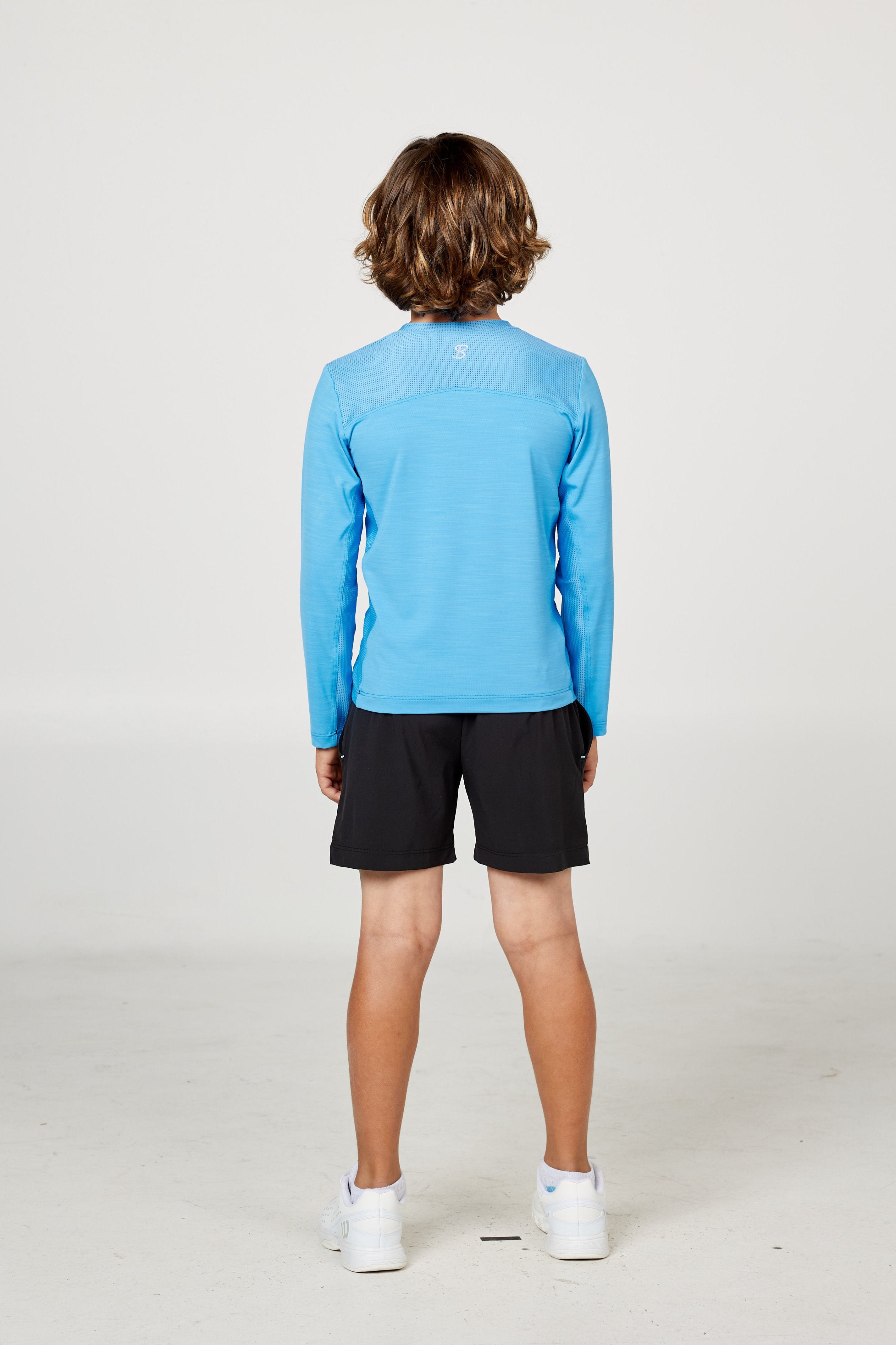 Perfect Volley Boy's Turquoise Long Sleeve Tennis Top by Sofibella, back view on model