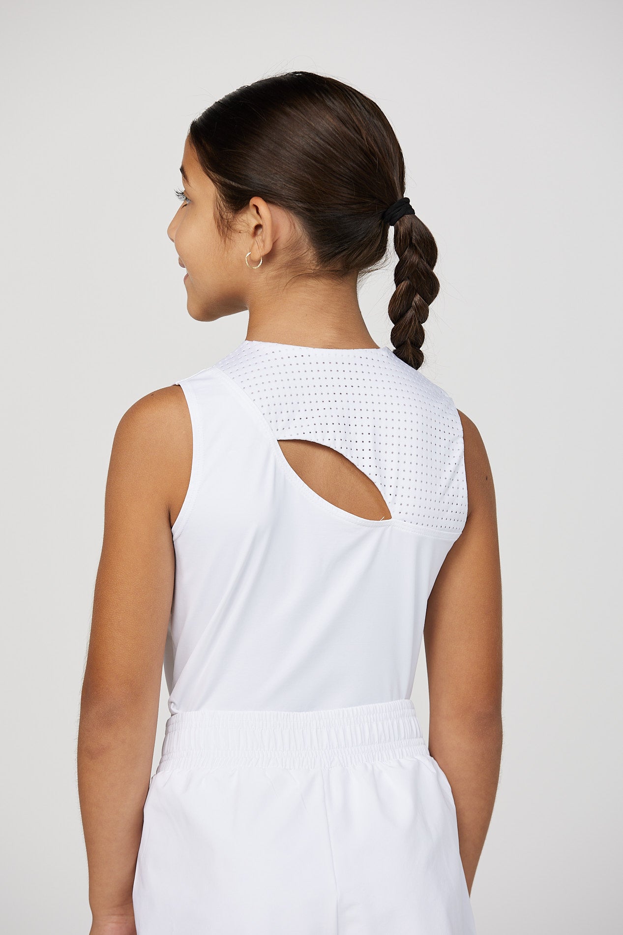 Girls' tennis tank top by Sofibella, close up view of back opening on model