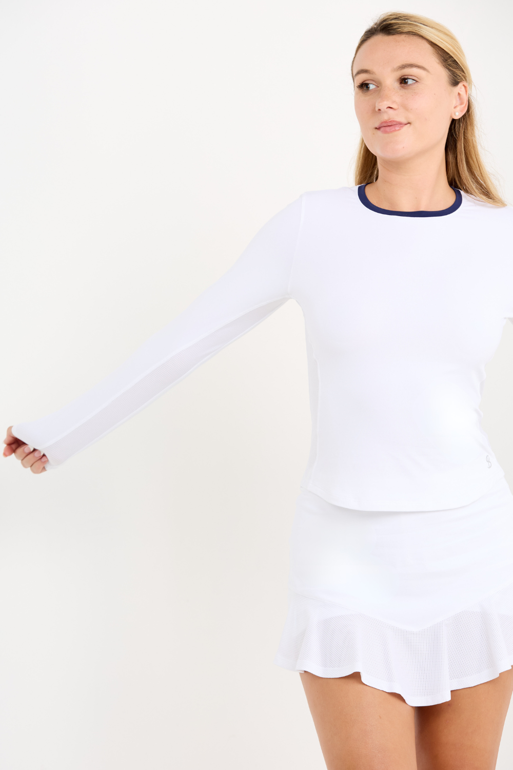 Women's White Long Sleeve Tennis Top by Sofibella, close up front view on model