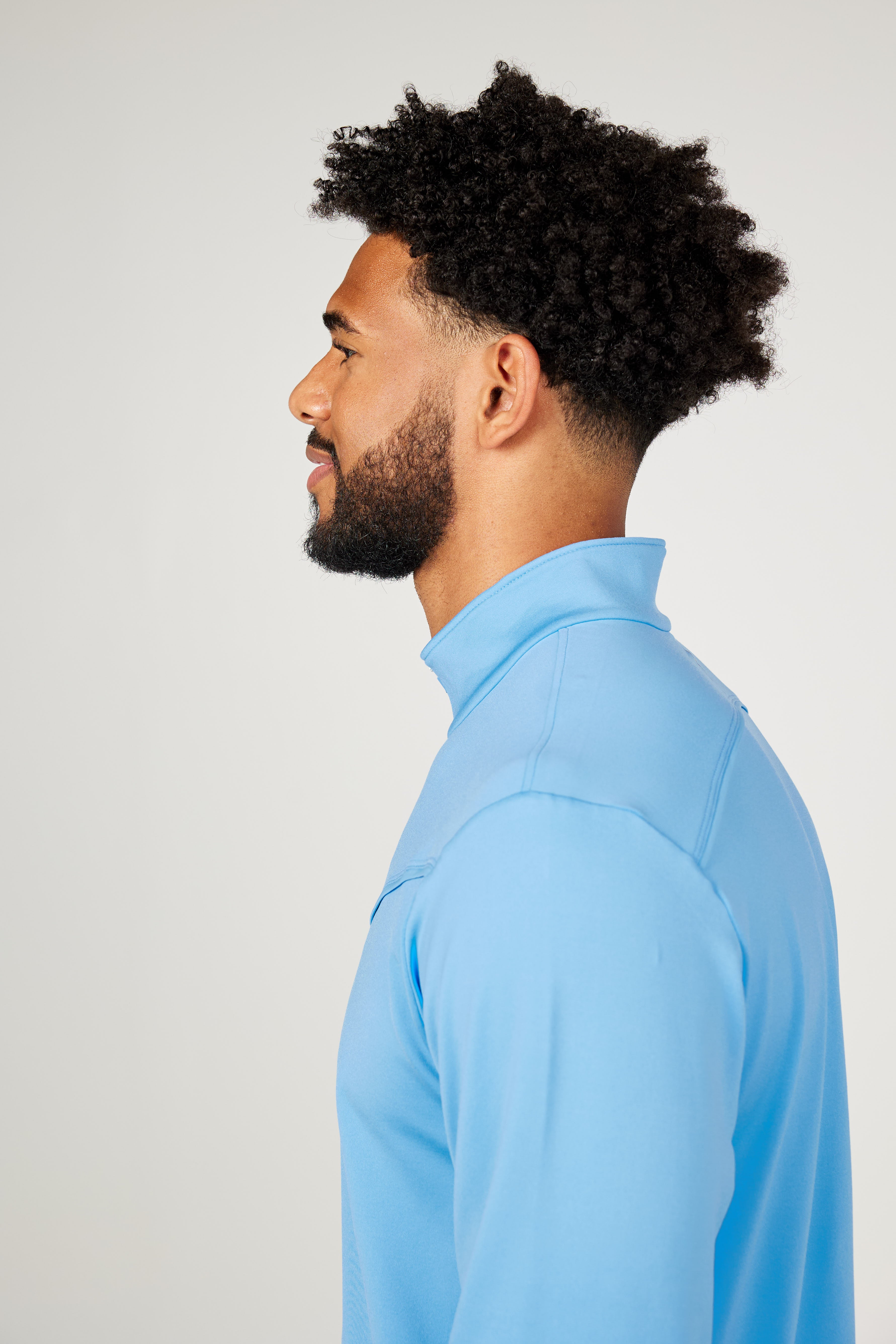 Men's Quarter Zip Neo Blue Tennis Long Sleeves Top by Sofibella, side view on model