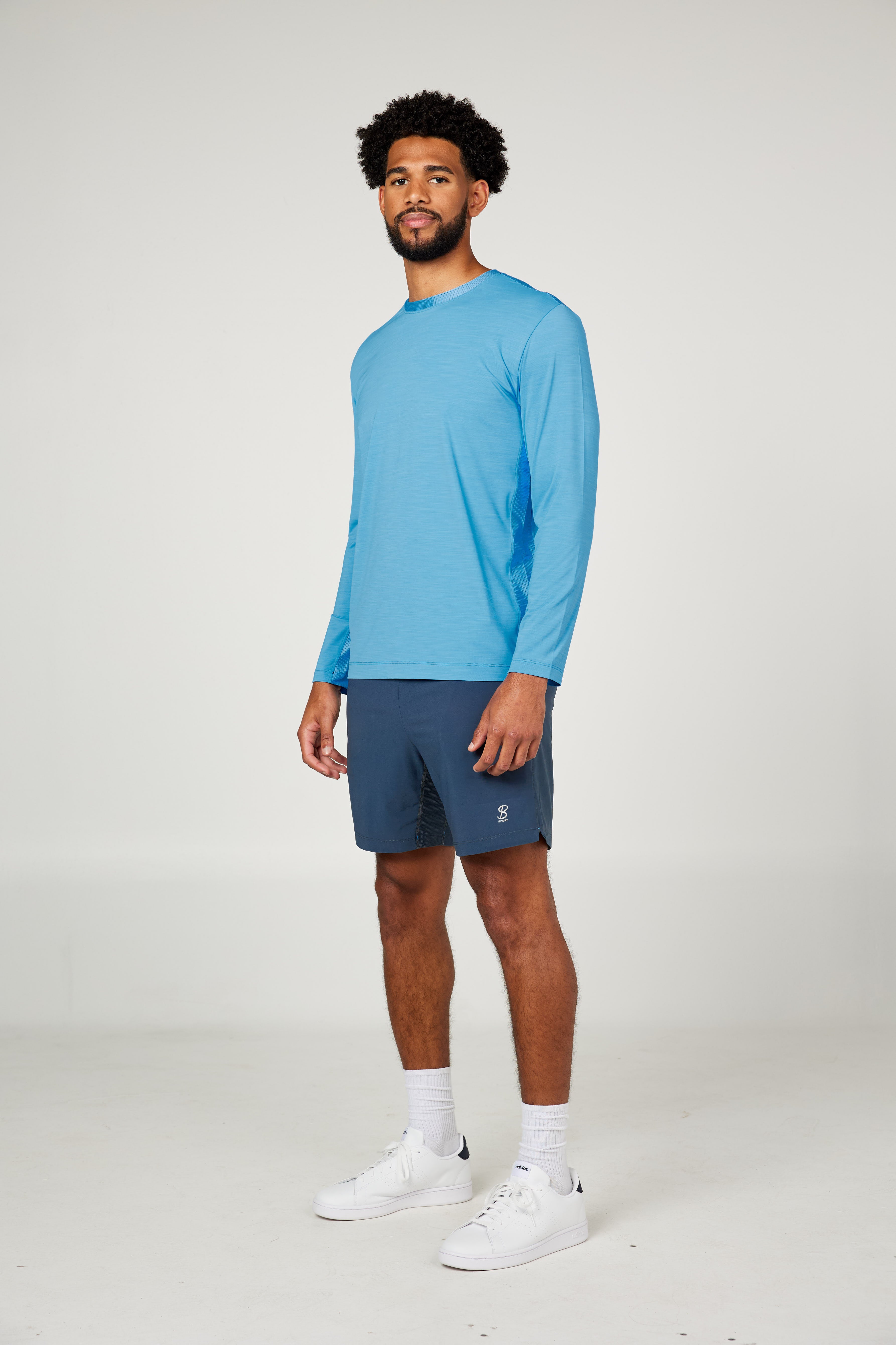 Perfect Volley Neo Blue Men's Long Sleeve Tennis Top by Sofibella, front view on model