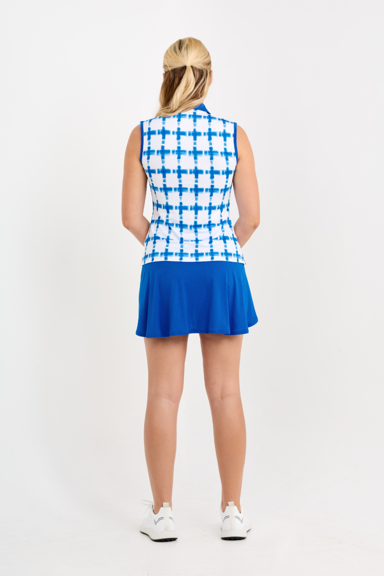 Miss Santorini Women's Sleeveless Polo Golf Top by Sofibella, back view on model