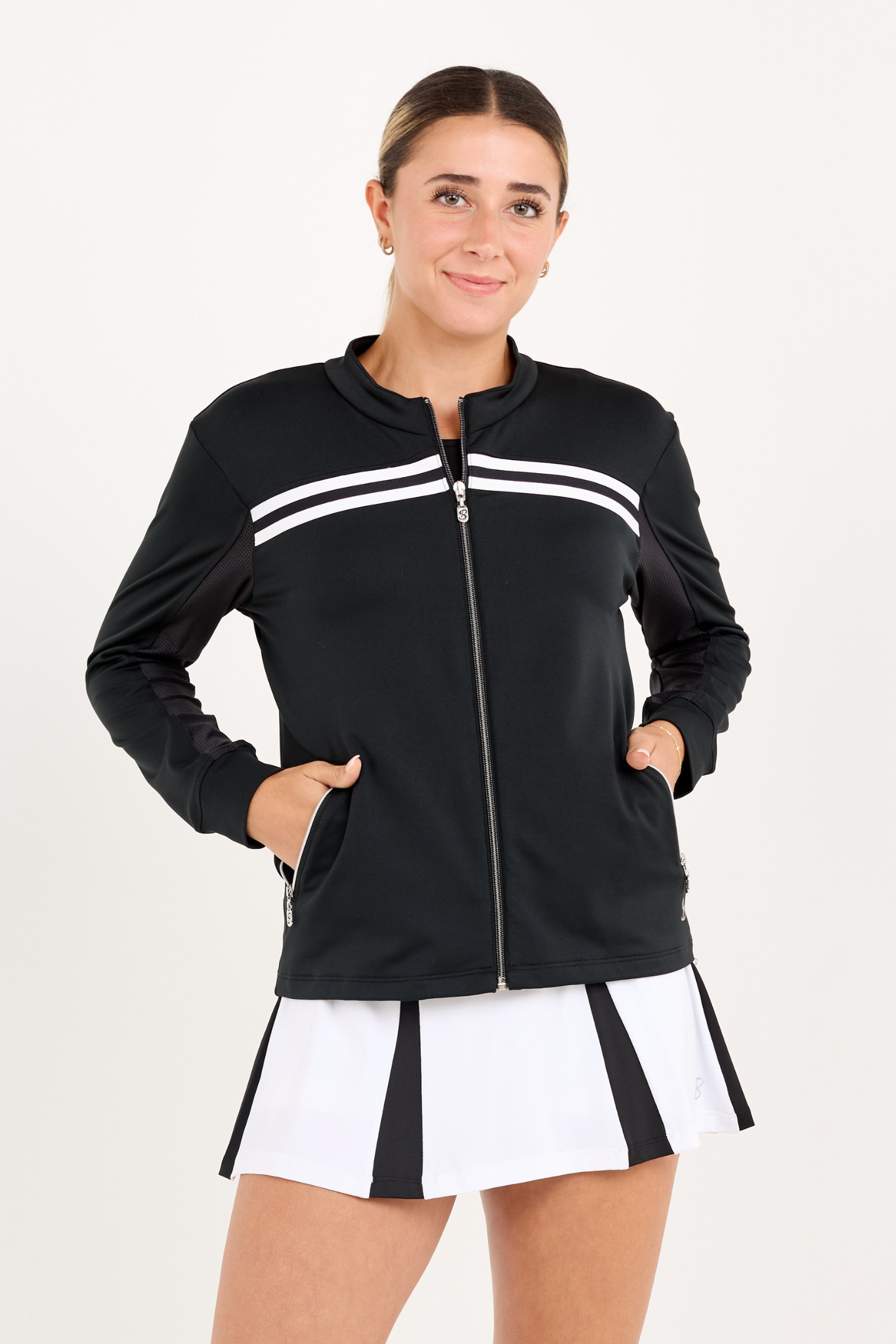 Black women's golf and tennis jacket with zipper, close up view