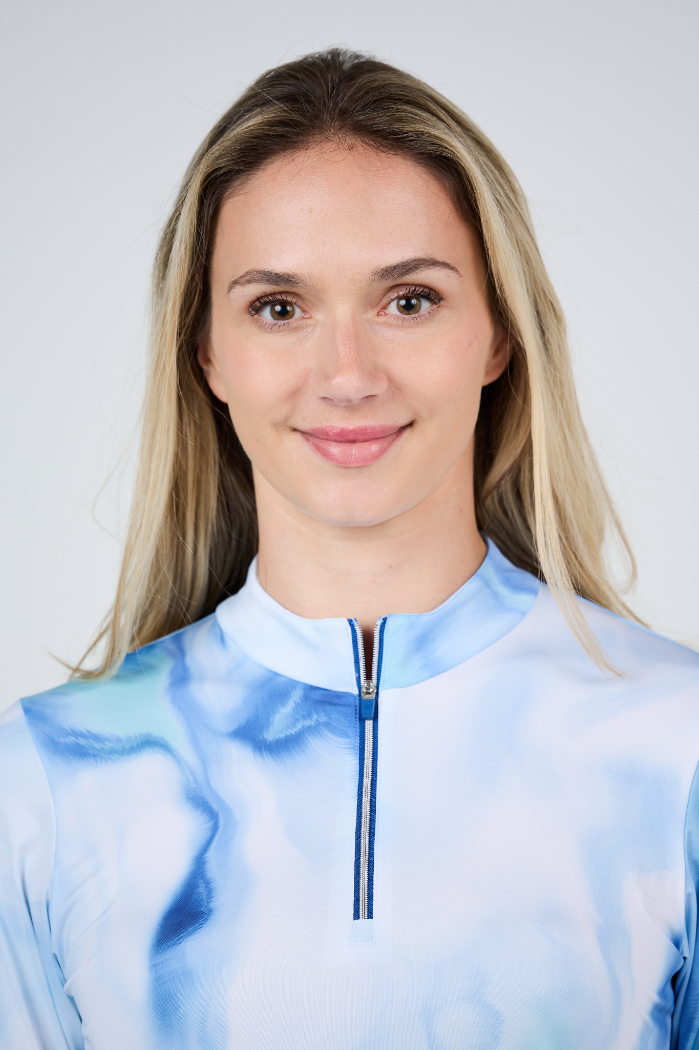 Didem Half-Zip Women’s Long Sleeve Tennis Top by Sofibella - front view on model