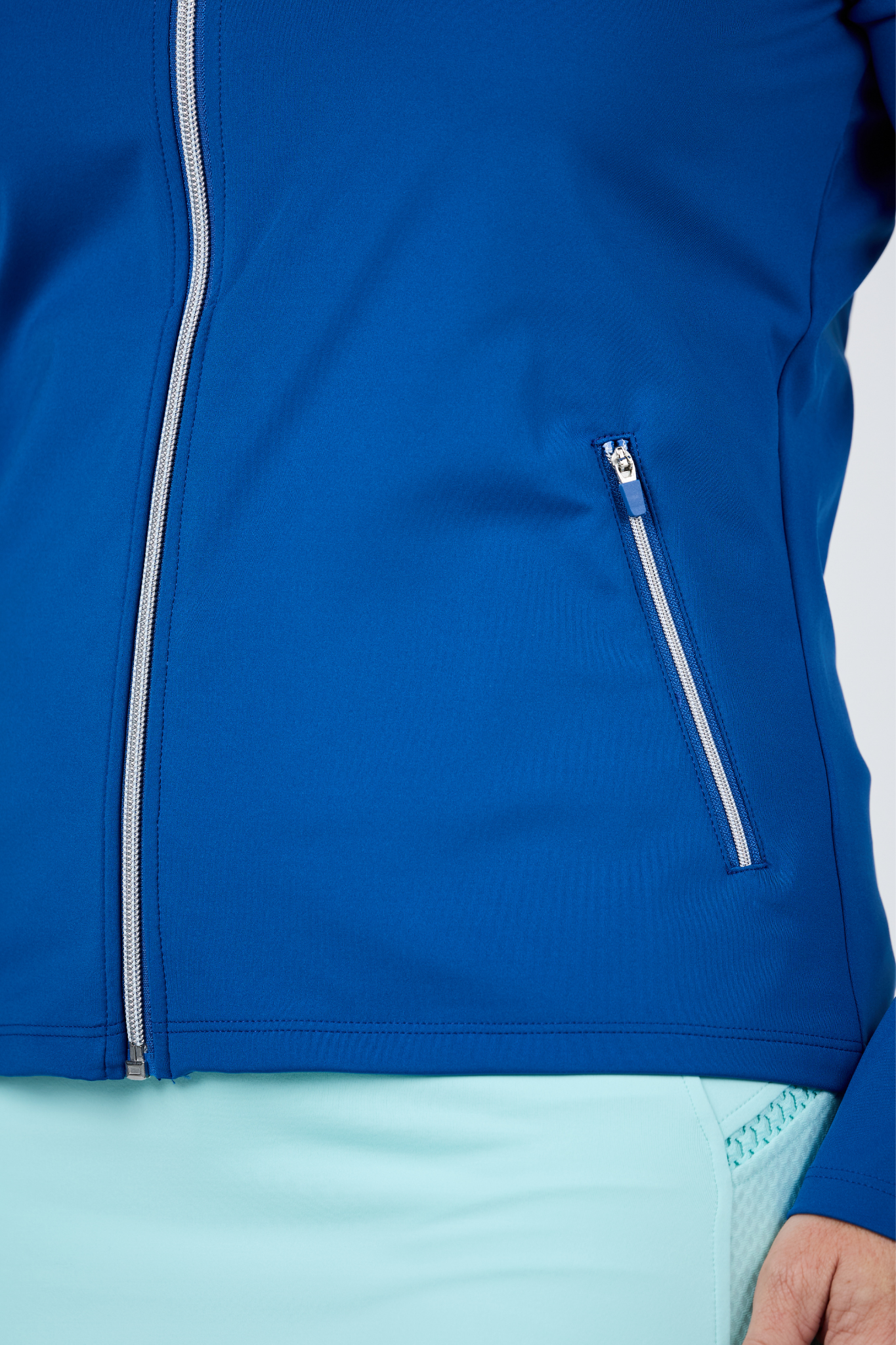 Perfect Storm Women's True Blue Split Zipper Jacket by Sofibella - front close up view on model
