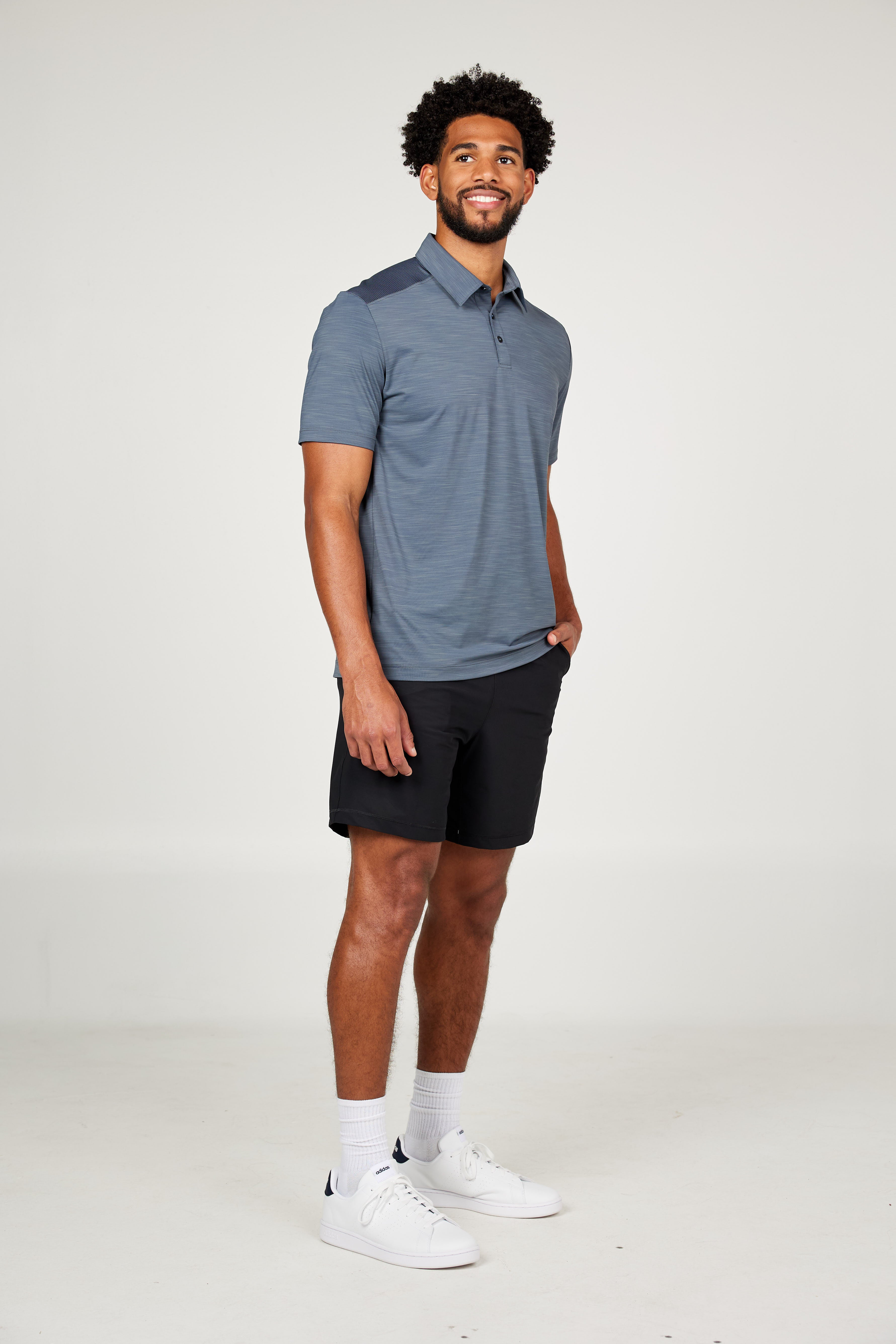 Men's Energy Short Sleeve Charcoal Polo Tennis Top by Sofibella, front view on model