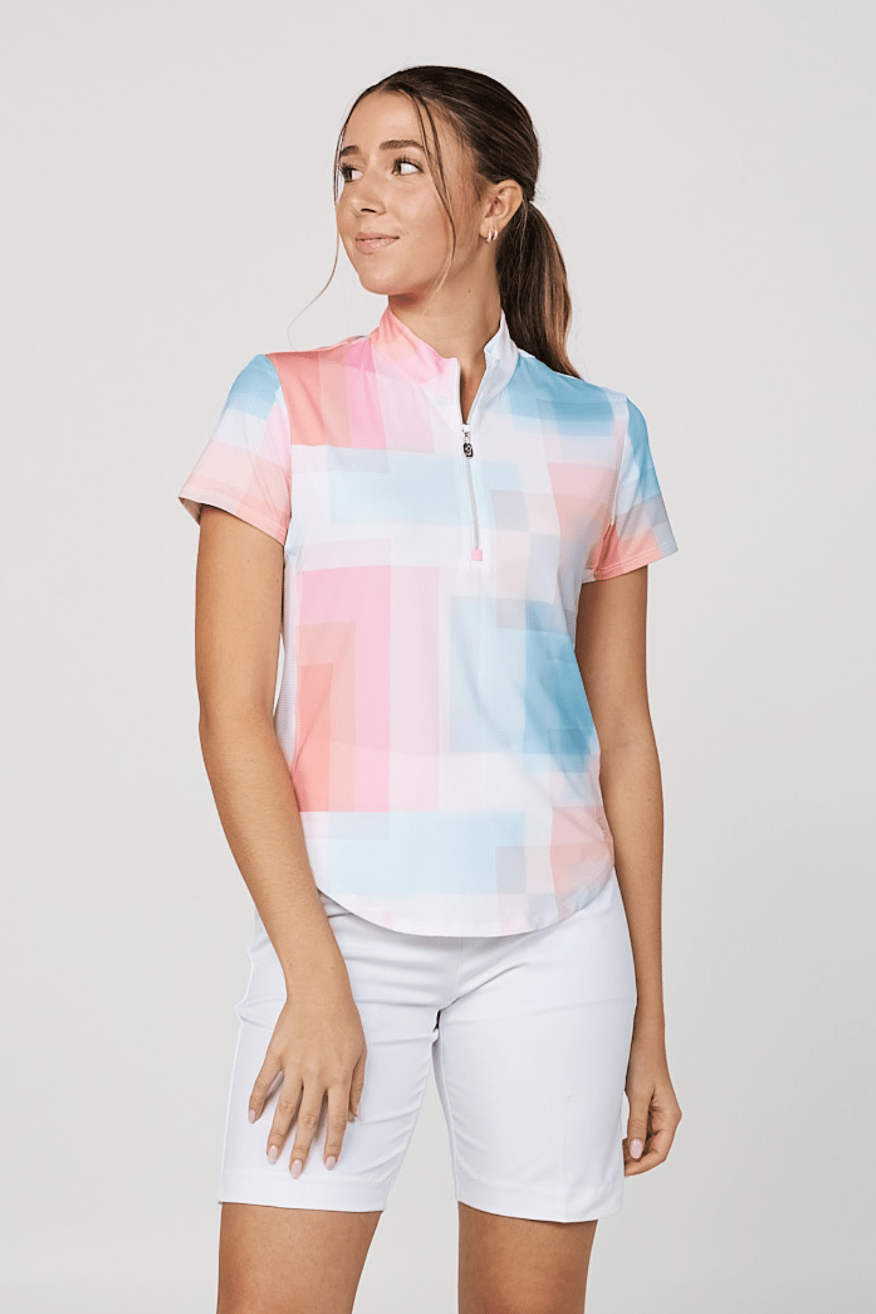 Women's golf short sleeve in pink, blue, and white front view