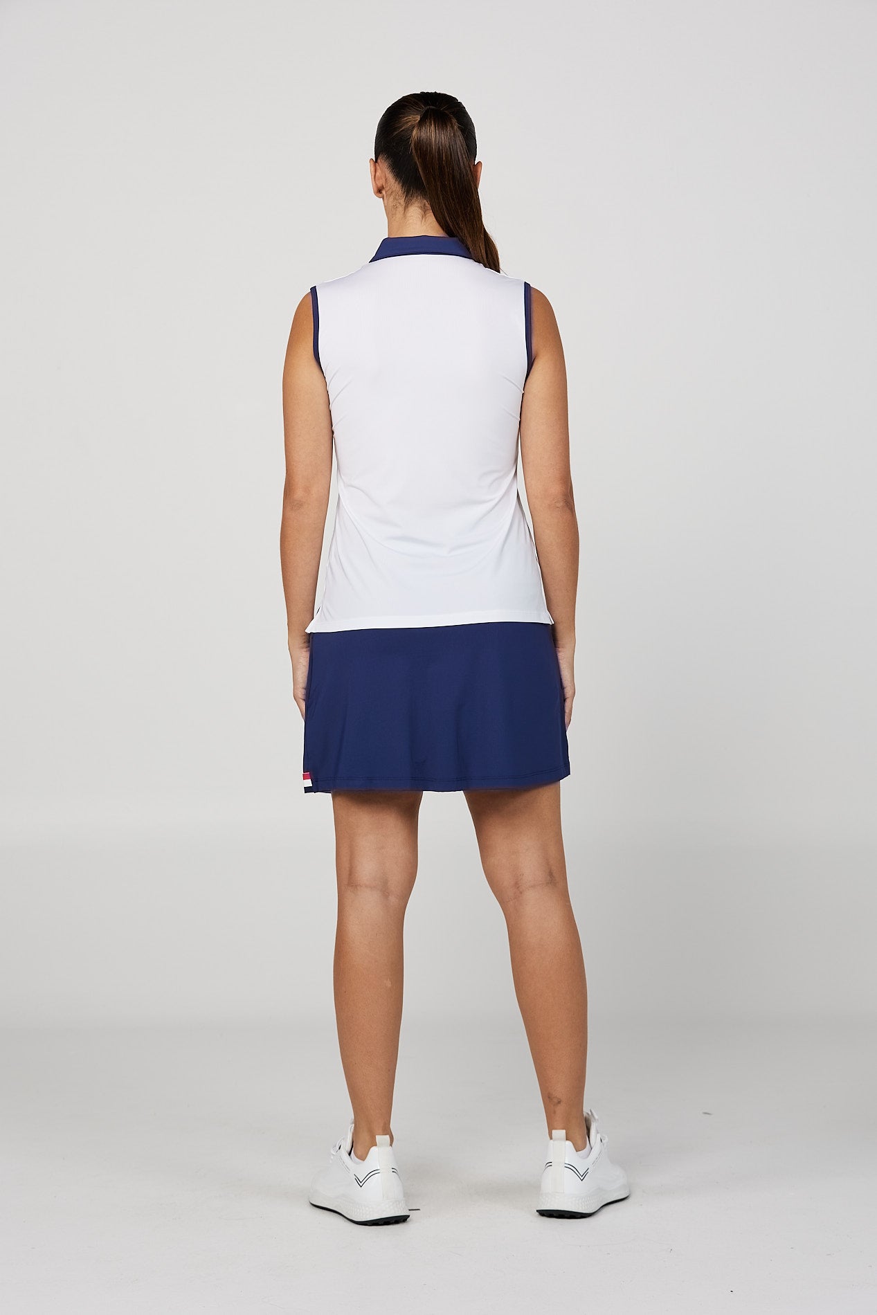 Women's Wild Flowers Golf Sleeveless Polo Top with Zipper by Sofibella, back view